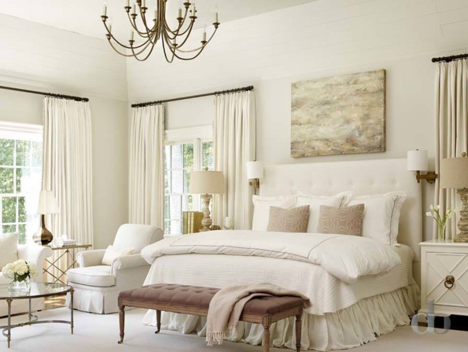 A master bedroom in a restful monotone color scheme.